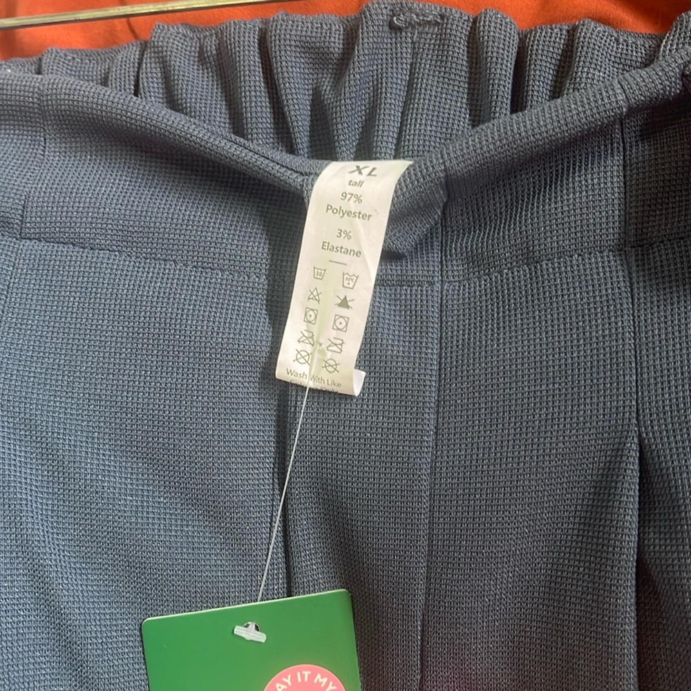 HALARA placated, side pockets, tall length one blue and one pair of ivory